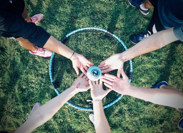 Zero Bounds ball over roundnet set with hands in circle